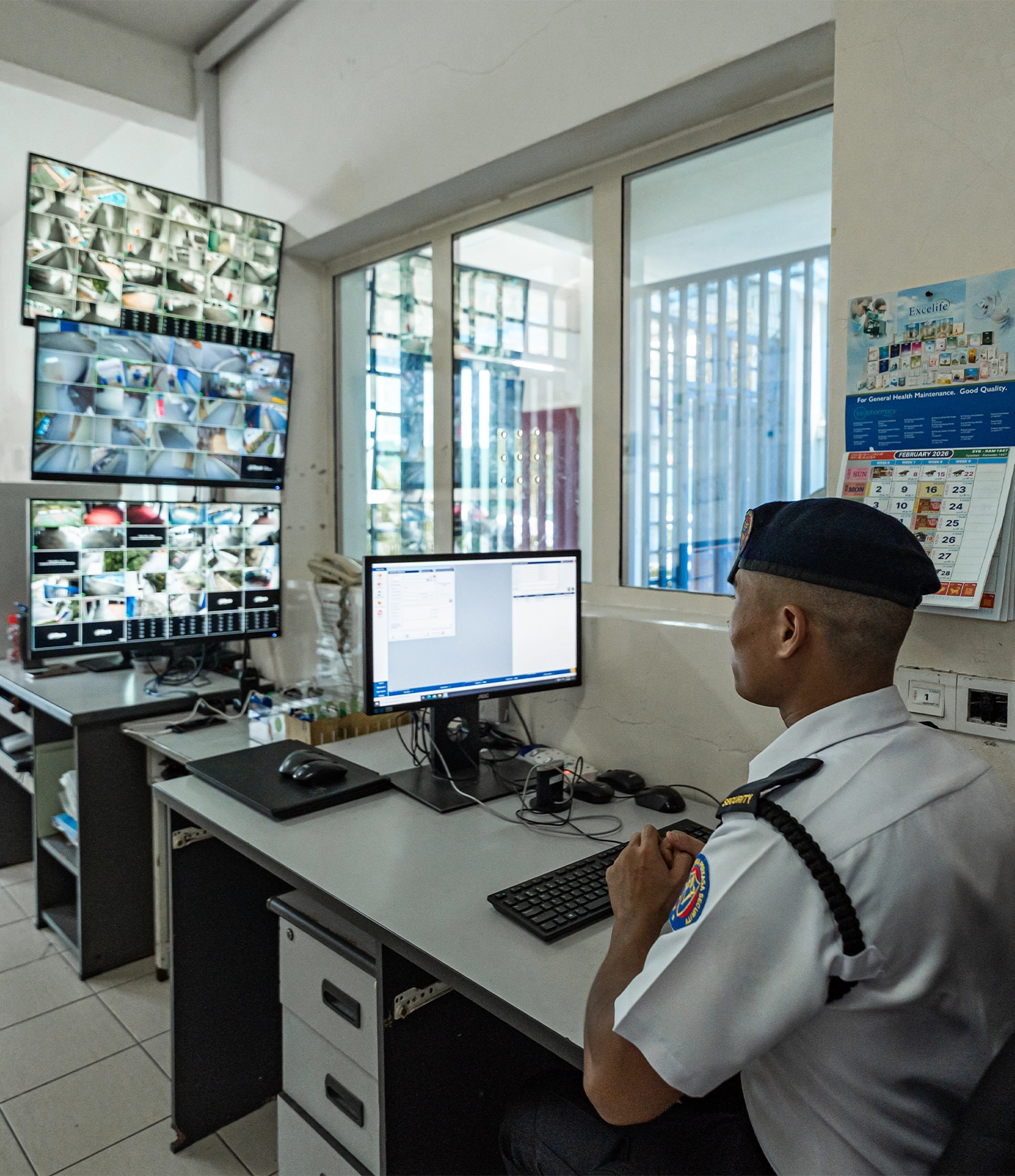 atria-perkasa-why-choose-us-guard-watching-screen